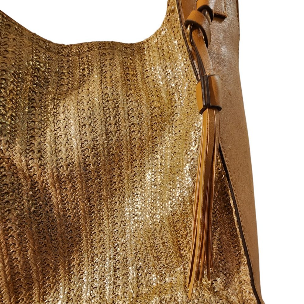 Shiny gold hand bag with tan leather accents